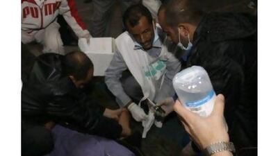 Medics treat an injured anti-government protester at a makeshift clinic outside Sana'a University.