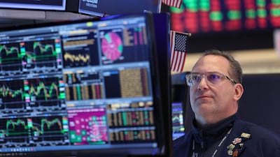 A trader on the floor of the New York Stock Exchange at the opening bell on March 24. AFP