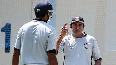 Aaqib Javed, right, is inspiring his UAE players to attend training despite their day jobs. Satish Kumar / The National