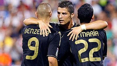 Cristiano Ronaldo, centre, celebrates scoring with Real Madrid teammates Karim Benzema and Angel Di Maria.