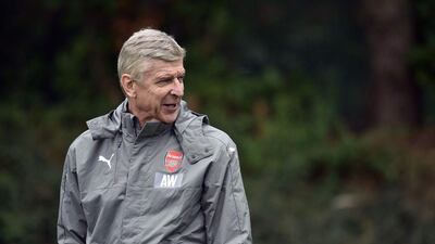Arsenal manager Arsene Wenger conducts a team training session ahead of their Champions League match. Glyn Kirk / AFP
