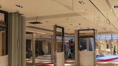 Cosmetic sales signs sit in a beauty product retail area inside the Samaritaine department store during renovation works. Bloomberg