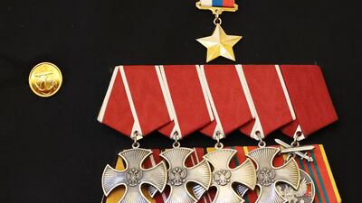 The Hero of Russia star and the Orders of Courage medals on a participant's uniform. AFP