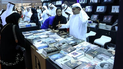 Visitors take a look at the books during the Sharjah International Book Fair at the Sharjah Expo Centre in Sharjah. Satish Kumar for the National