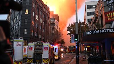 More than 100 firefighters battle the flames from a seven-storey blaze in central Sydney on Thursday. EPA