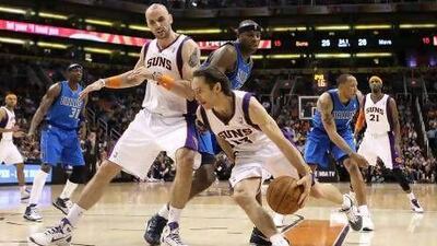Steve Nash, No 13, has spent eight seasons at the Phoenix Suns but never won the NBA title. Christian Petersen / Getty Images