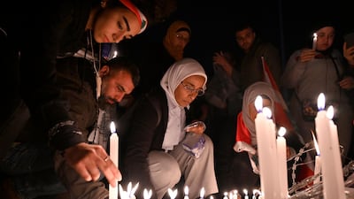 Anti-government protesters light candles after protester Ahmad Tawfik died, in Martyrs' Square, Beirut, Lebanon. EPA