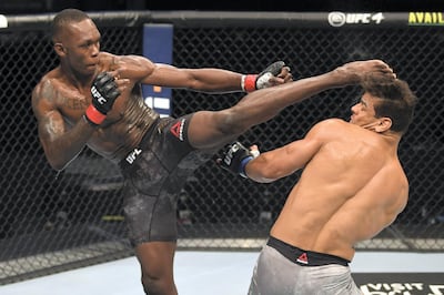 Israel Adesanya lands a kick to the head of Paulo Costa. Zuffa LLC