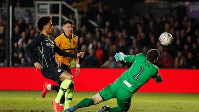 Newport goalkeeper Joe Day makes a save from Manchester City's Leroy Sane. Reuters