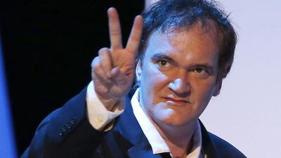US director Quentin Tarantino flashes the victory sign as he walks on stage. Etienne Laurent / EPA
