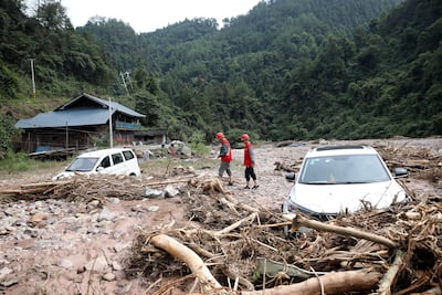 Electrical workers inspect damaged power facilities in village in China's Hunan province on Sunday. Reuters