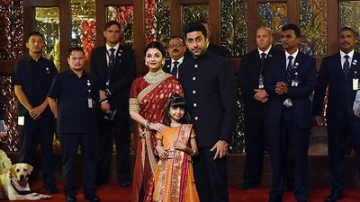 Indian Bollywood actors Aishwarya Rai Bachchan and Abhishek Bachchan with daughter Aradhya pose for a picture. AFP