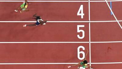 Jamaica's Elaine Thompson-Herah crosses the finish line to win the women's 200m final.