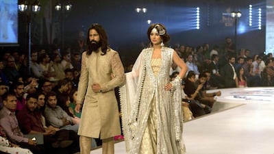 Models present creation by designer Sana Abbas. Shakil Adil / AP photo