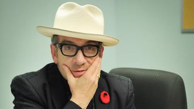 Elvis Costello signs copies of his new book, Unfaithful Music & Disappearing Ink, in Toronto. Getty Images