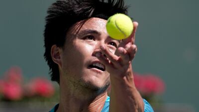 Taro Daniel, of Japan, serves to Andy Murray, of Britain. AP Photo