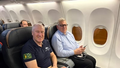 Robert Pether, right, departs Iraq, accompanied by Australia's ambassador to the country, Glenn Miles. Photo: Australian Foreign Ministry