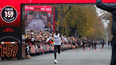 Kenya's Eliud Kipchoge, the marathon world record holder, crosses the finish line during his attempt to run a marathon in under two hours in Vienna, Austria. REUTERS