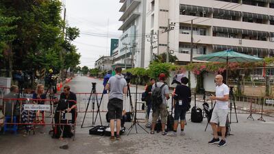 Journalists wait for the arrival outside the hospital. EPA