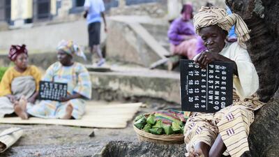 An actress holds a slate as she performs a scene during the making of ‘Ake’, a film based on the childhood memoirs of Nigerian writer Wole Soyinka, in Abeokuta, Nigeria.