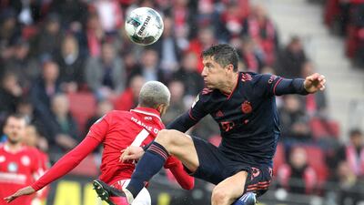 Mainz defender Jeremiah St Juste and Bayern's Robert Lewandowski battle for possession. AFP