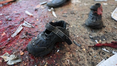 A child's shoes lying in blood at the site of an Israeli strike in Gaza city. Reuters