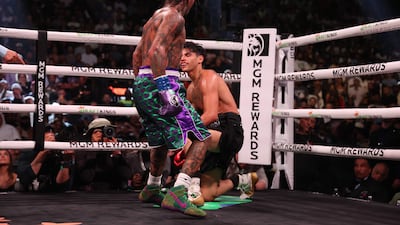 Gervonta Davis stands over Ryan Garcia after sending Garcia to the canvas with a body shot. Getty