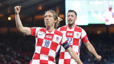 Croatia midfielder Luka Modric celebrates after scoring his team's second goal against Scotland. EPA