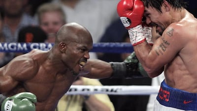 Timothy Bradley lands a blow on Manny Pacquiao in their 2014 fight. AFP