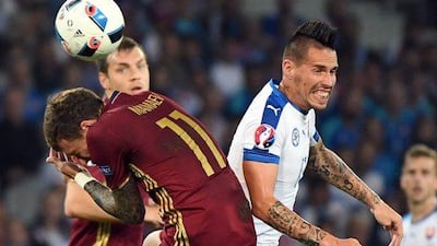 Slovakia's Marek Hamsik, right, collides with Russia's Pavel Mamaev during the Euro 2016 Group B match at the Pierre Mauroy stadium in Villeneuve d’Ascq, near Lille, France, Wednesday, June 15, 2016. AP Photo/Geert Vanden Wijngaert