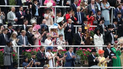 Crowds cheer and clap as Queen Elizabeth II arrives on day five of Royal Ascot at Ascot Racecourse. PA Images