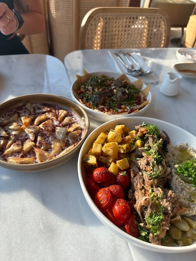 Clockwise from top, kaftah fatteh, manti and shawarma bowl at Zali. Fatima Al Mahmoud / The National