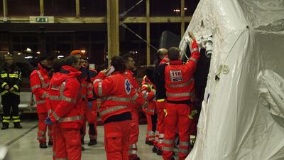 Italian Red Cross operators prepare the camp to accomodate the passengers of the “Norman Atlantic” ferry at port of Brindisi, southern Italy, during the night of December 29. Carlo Hermann / AFP