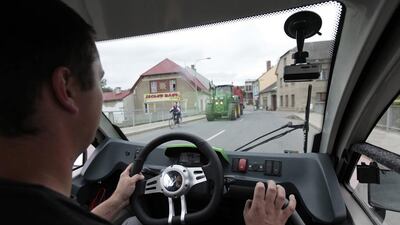 A factory worker steers an Elbee vehicle during a test drive in Lostice. Factory production of the first batch of Elbee vehicles started this year after completing initial road tests and homologation from local authorities received in 2010. David W Cerny / Reuters