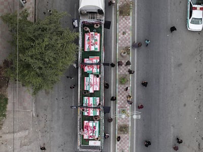 Coffins were being transported in the city of Minab on Tuesday before a funeral for victims of an air strike that hit a school. EPA