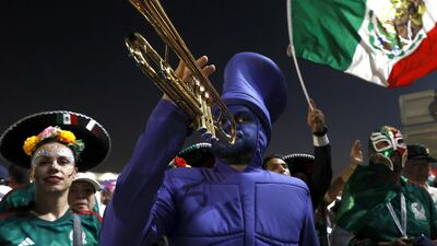 Mexico fans get some musical accompaniment for their Group C match against Poland at Stadium 947, Ras Bu Abboud, east of central Doha. EPA