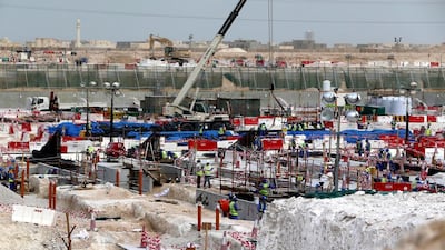 Labourers work at the construction site of the Al Wakrah football stadium, one of the Qatar's 2022 World Cup stadiums in May 2015. Marwan Naamani / AFP Photo