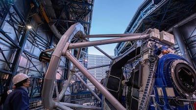 Chilean astronomer Luis Chavarria looks at one of the optical telescopes on the platform of the Very Large Telescope (VLT) at the European Southern Observatory in Chile's Antofagasta region. AFP