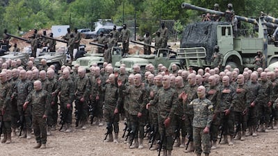 Hundreds of masked fighters at the media event. Reuters