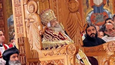 The body of Pope Shenouda III is displayed for public viewing inside the Abbasiya Cathedral in Cairo.