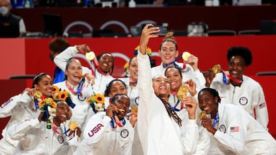 Brittney Griner of Team United States takes a selfie with her teammates and their gold medals during the Women's Basketball medal ceremony.