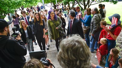 Youth plaintiffs in the climate change lawsuit arrive at the Lewis and Clark County Courthouse in Helena, Montana. AP