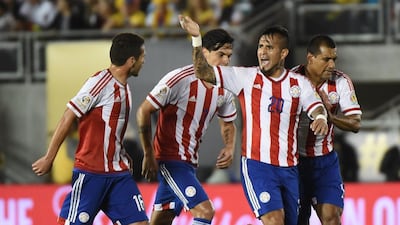 Paraguay’s Victor Hugo Ayala (R) celebrates after scoring against Colombia during their Copa America Centenario football match, in Pasadena, California, United States, on June 7, 2016. Mark Ralston / AFP