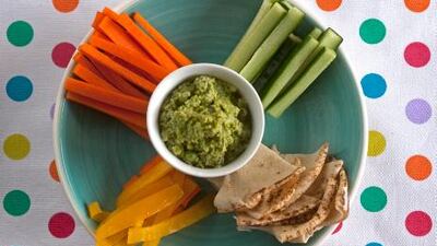 Hummus made with peas rather than the more usual chick peas and presented in style with triangles of flat bread and vegetables cut into dipping sticks.