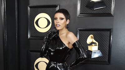 Doja Cat arrives in latex Versace. EPA