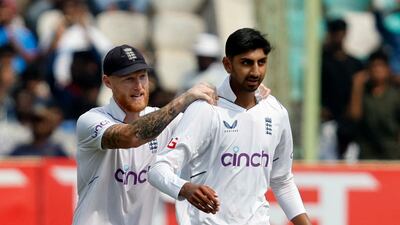 England spinner Shoaib Bashir is congratulated by his captain Ben Stokes after taking the wicket of India's Mukesh Kumar for a duck. Reuters