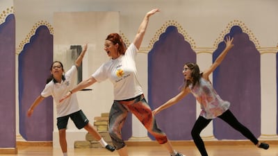 Suzanne Clandon teaches tap dancing to Elena Thomson, left, and Carolina Patricio at Deira International School. Pawan Singh / The National
