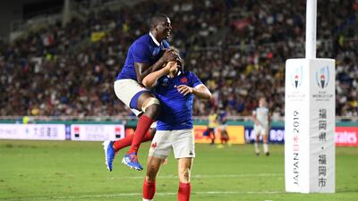 France's Baptiste Serin celebrates with France's Yacouba Camara scoring their fourth try, France v USA - Fukuoka Hakatanomori Stadium, Fukuoka, Japan. REUTERS