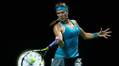 Eugenie Bouchard returns a shot to Ana Ivanovic in her loss at the WTA Finals on Wednesday. Julian Finney / Getty Images / October 22, 2014