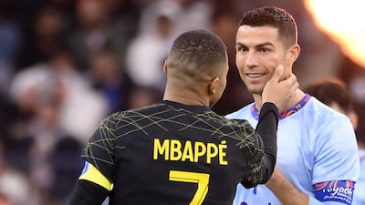 PSG's Kylian Mbappe greets Cristiano Ronaldo. AFP
